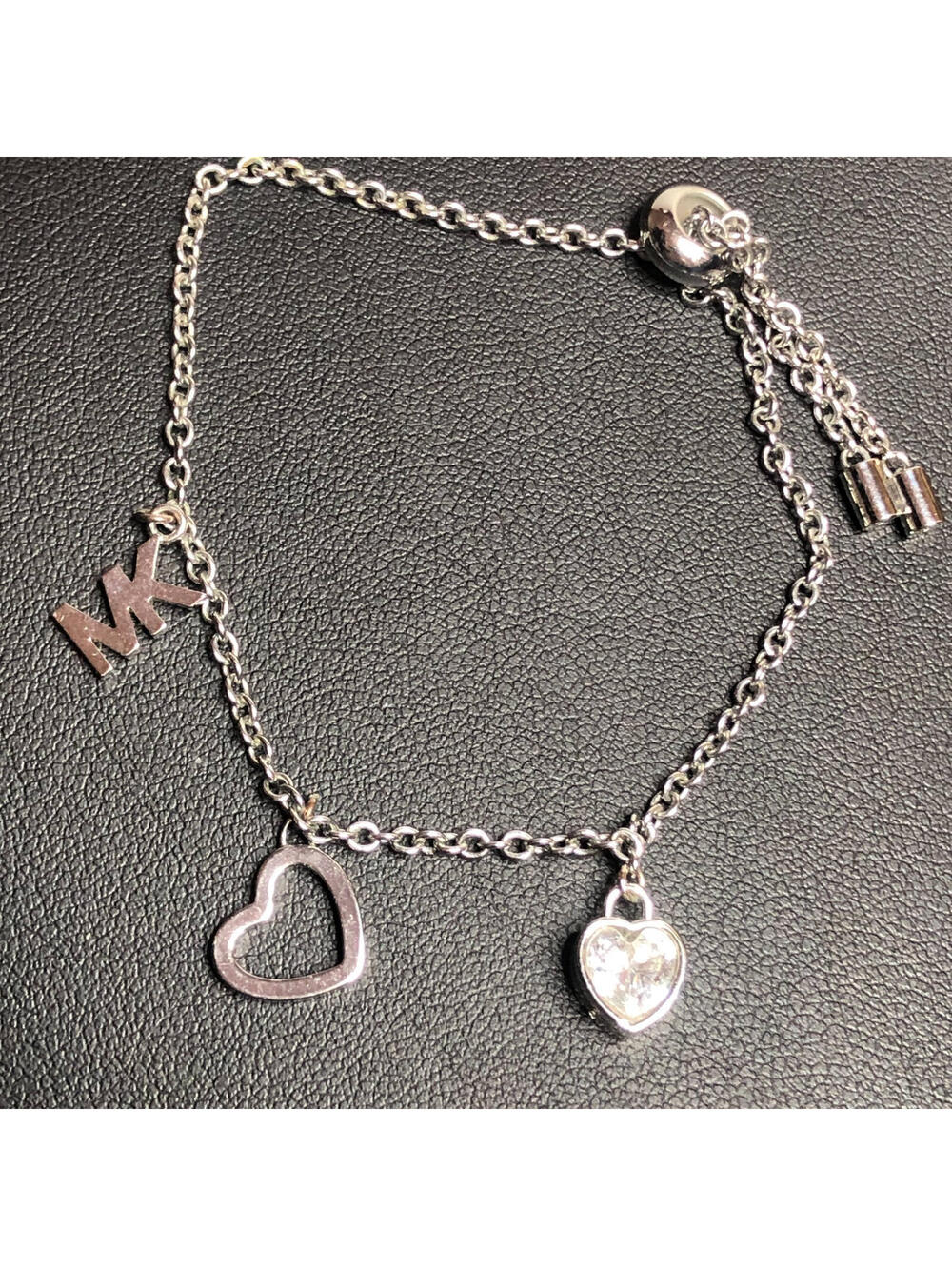 5142 Michael Kors silver tone Crystal Heart MK logo charm Bracelet adjustable